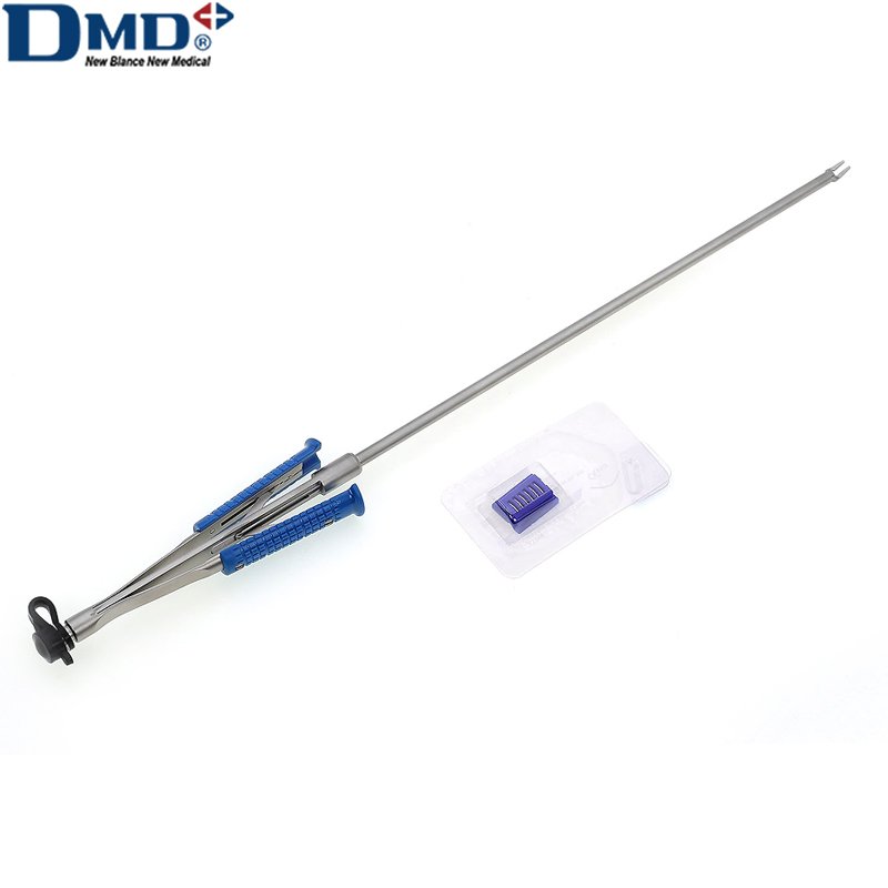 DMD long-shaft tweezer applier with blue handles, shown beside a clip cartridge